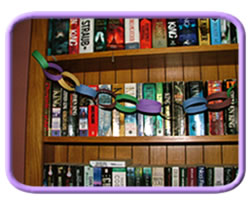 paper chains hanging in front of book shelf