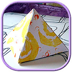 pyramid paperweight decorated with stencil painting